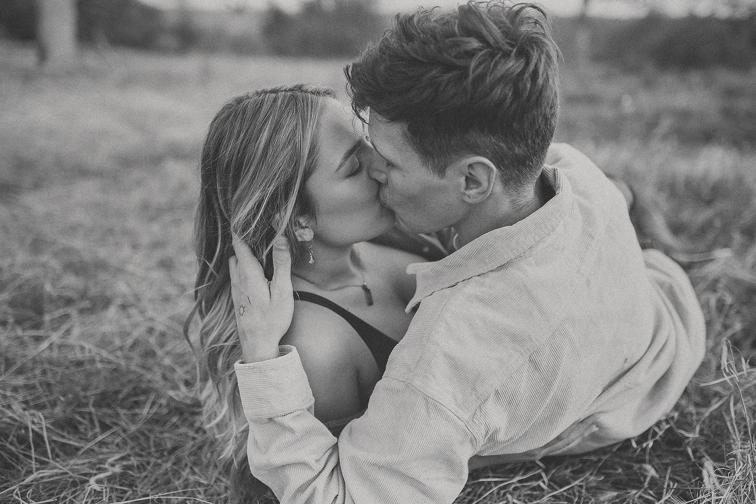Engaged couple during a romantic engagement session in Northern California field