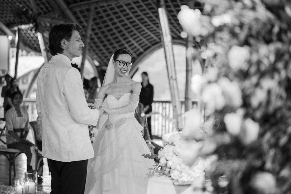 Black and white wedding ceremony shots showing intimate moments between the couple.