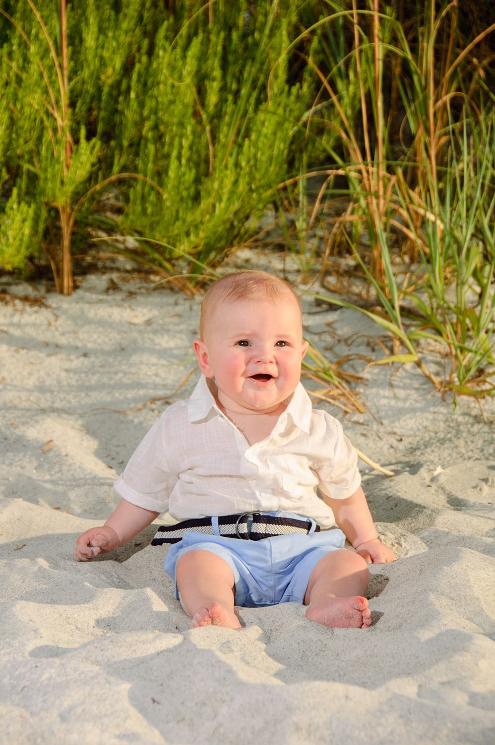 photo of infant boy sitting on beach in New Port Richey