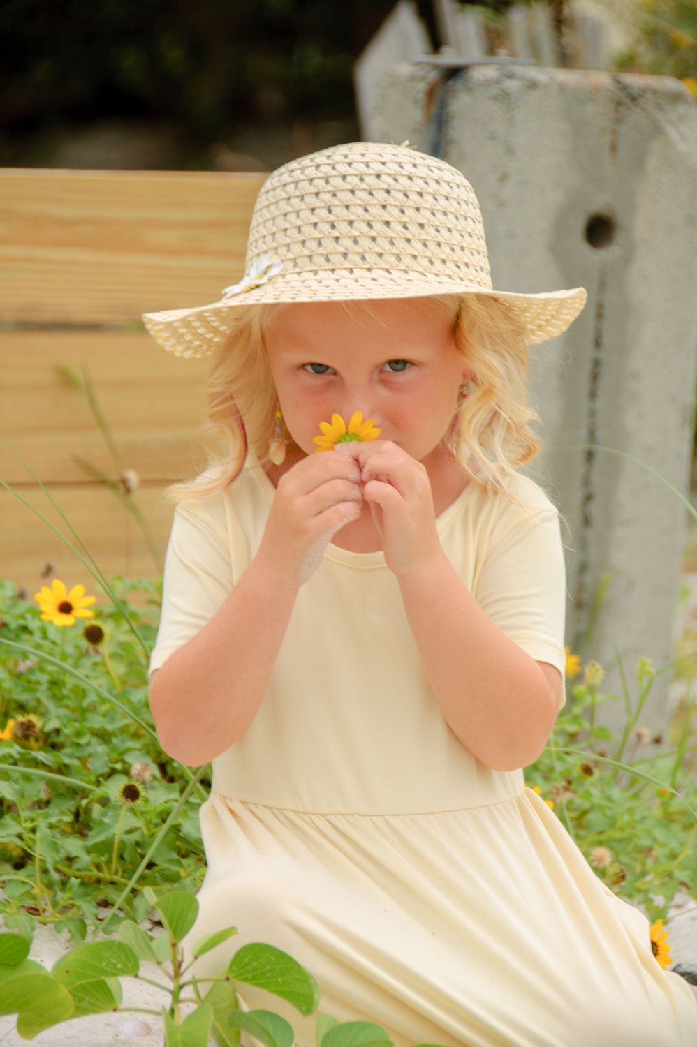 photo of young girl smelling flowers in New Port Richey