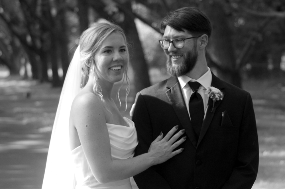 Candid wedding moments captured in black and white photography.