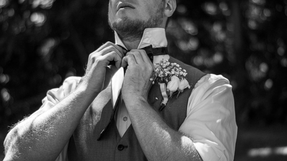 Black and white portrait sequence of a wedding couple sharing intimate moments.