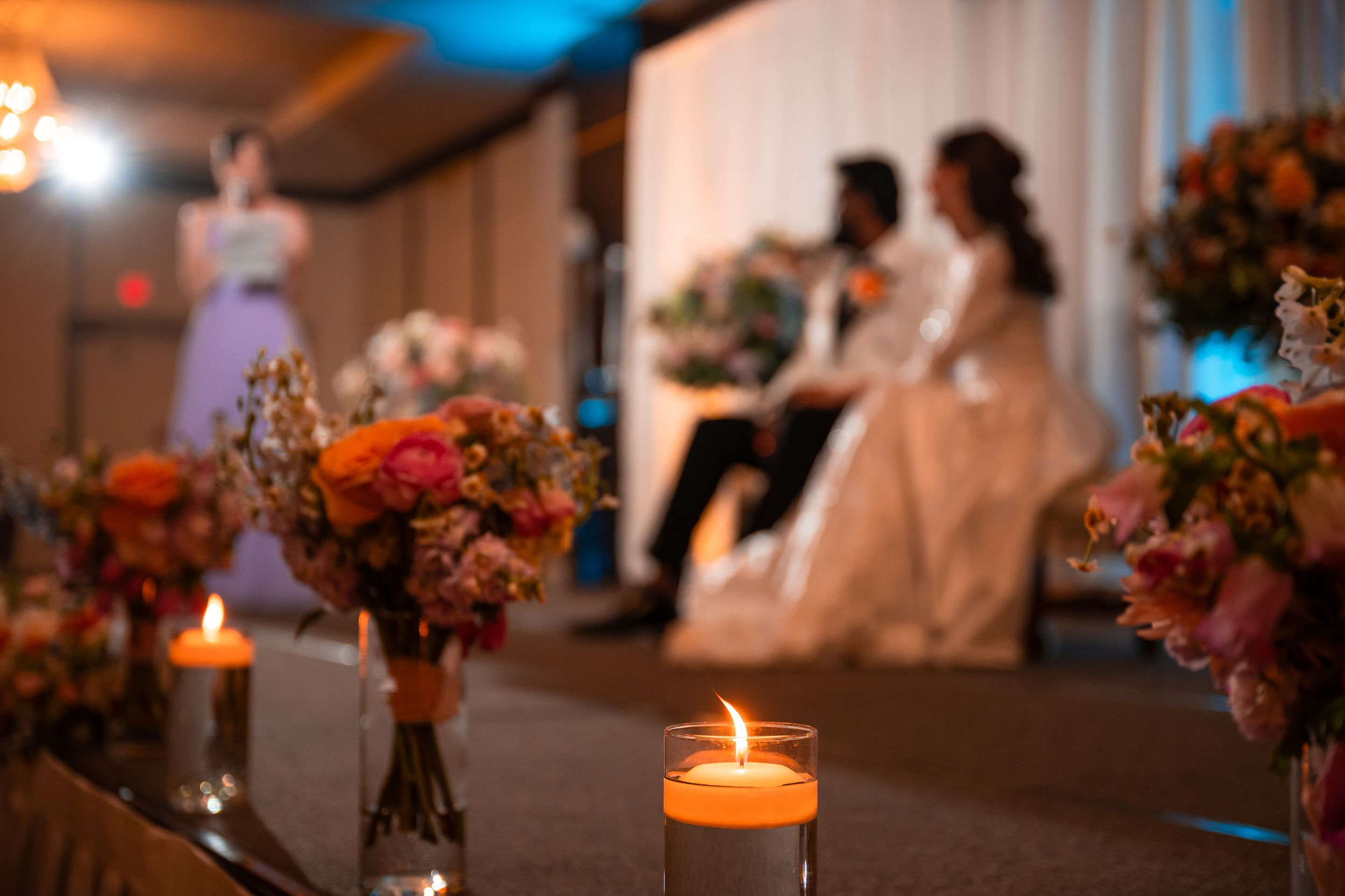 Gorgeous bride smiling with joy and laughter on her wedding day, her husband elated in the background, St. James, Utica, 2024