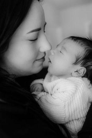 Newborn and mother captured by newborn Maryland photographer Mallory Bramlett.