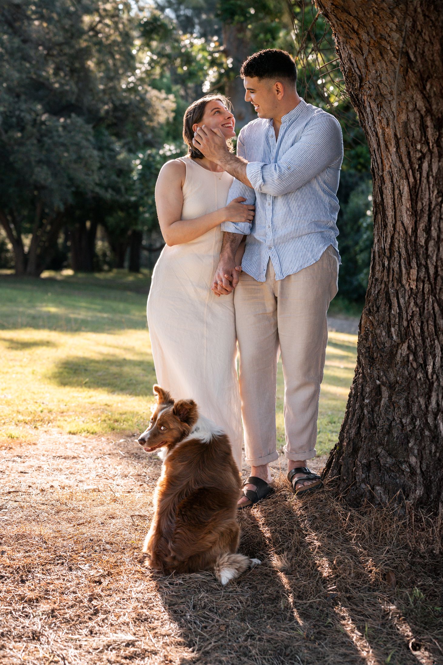 man-emotionally-fixes-women-hair-during-a-proposal-photoshoot-included-their-dog-in-sydney