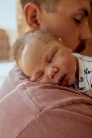 A series of photos showing a sleeping baby in a pink onesie, captured in close-up profile views.