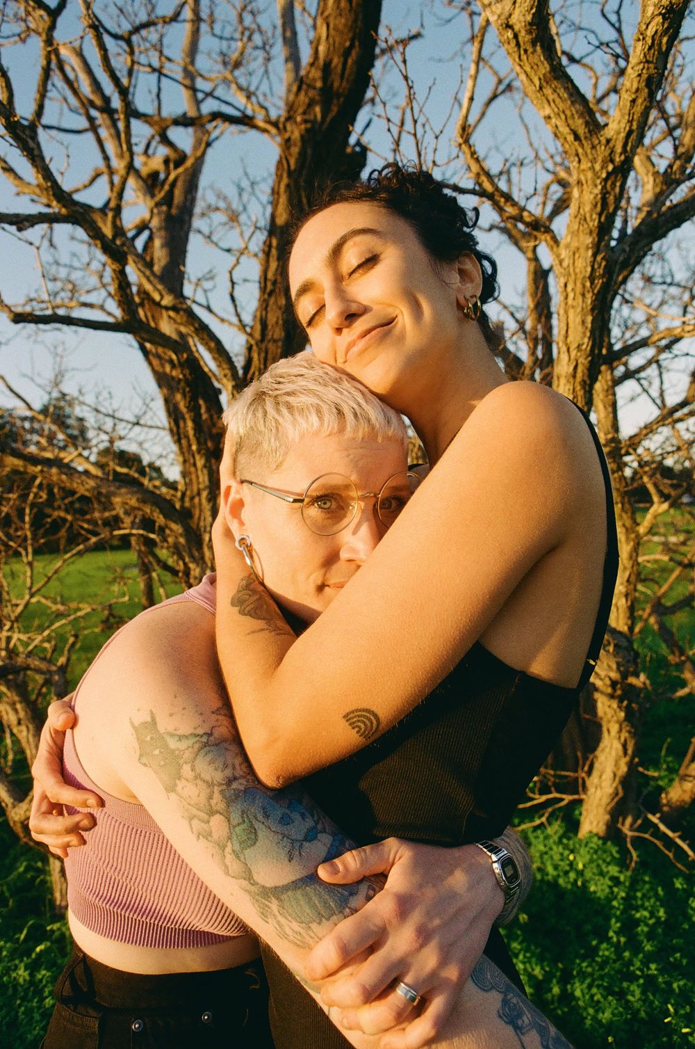 Intimate LGBTQ+ couple portrait in nature, celebrating one year together, Perth queer-friendly photographer.