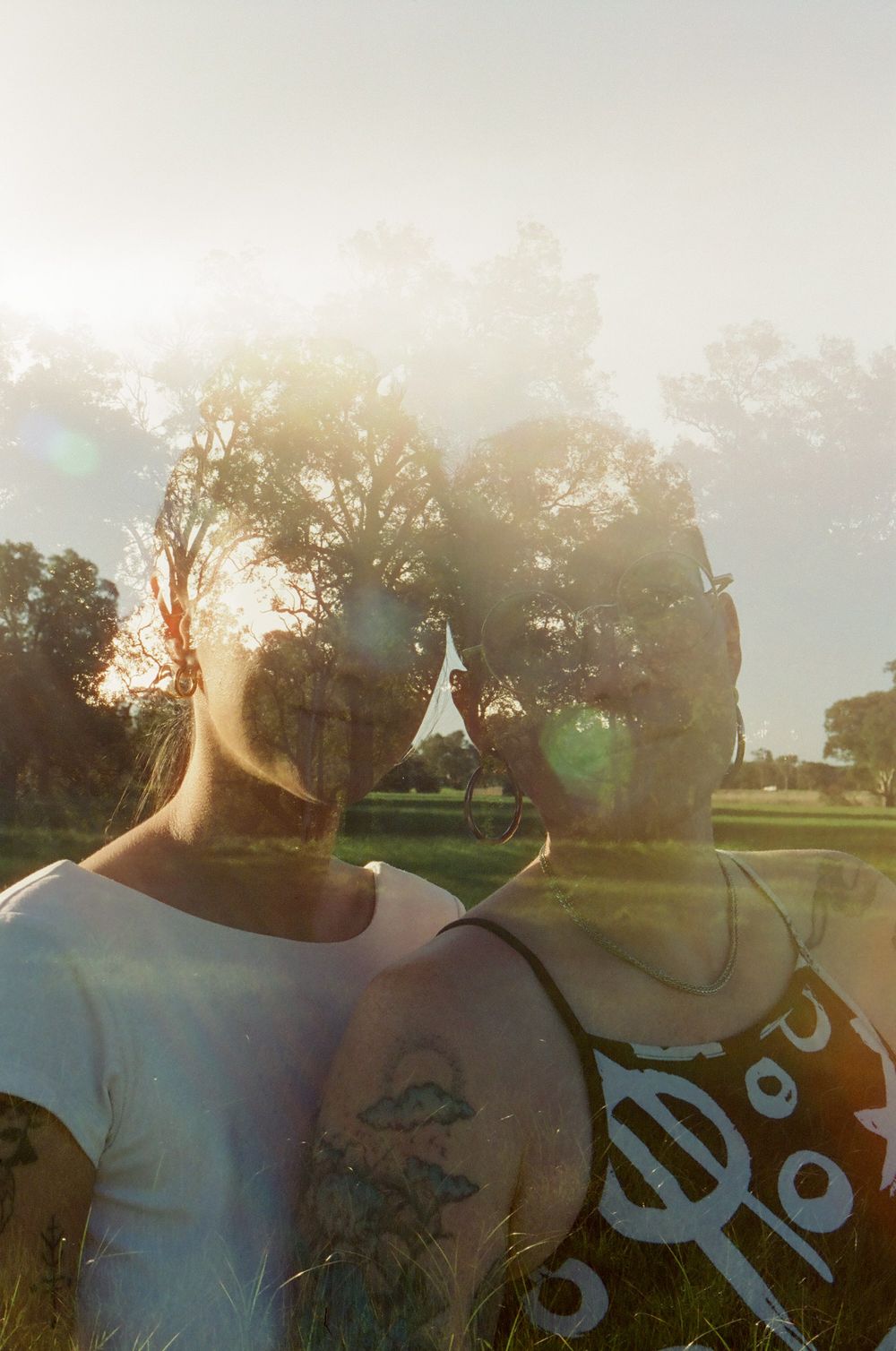Double exposure film photograph of queer couple Sarah and Viviane, celebrating their anniversary in Perth, LGBTQ+ friendly photography.