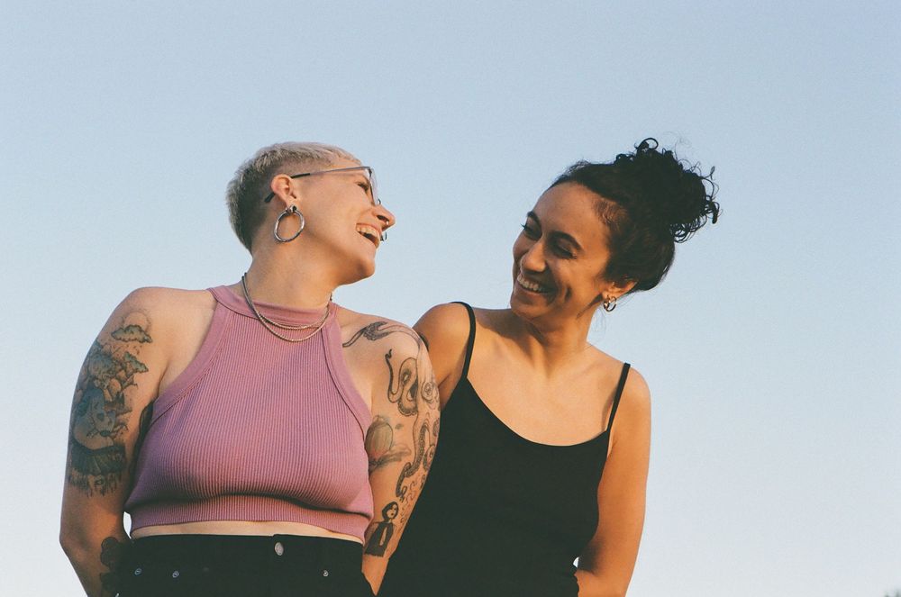 Intimate LGBTQ+ couple portrait in nature, celebrating one year together, Perth queer-friendly photographer.