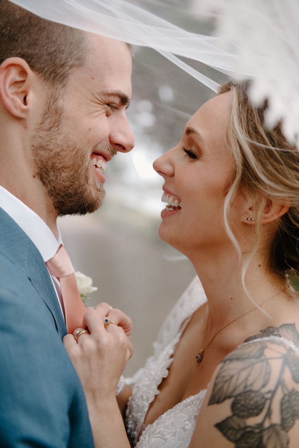 A romantic wedding couple shares intimate moments in a series of close-up shots showing joyful laughter and tender expressions.