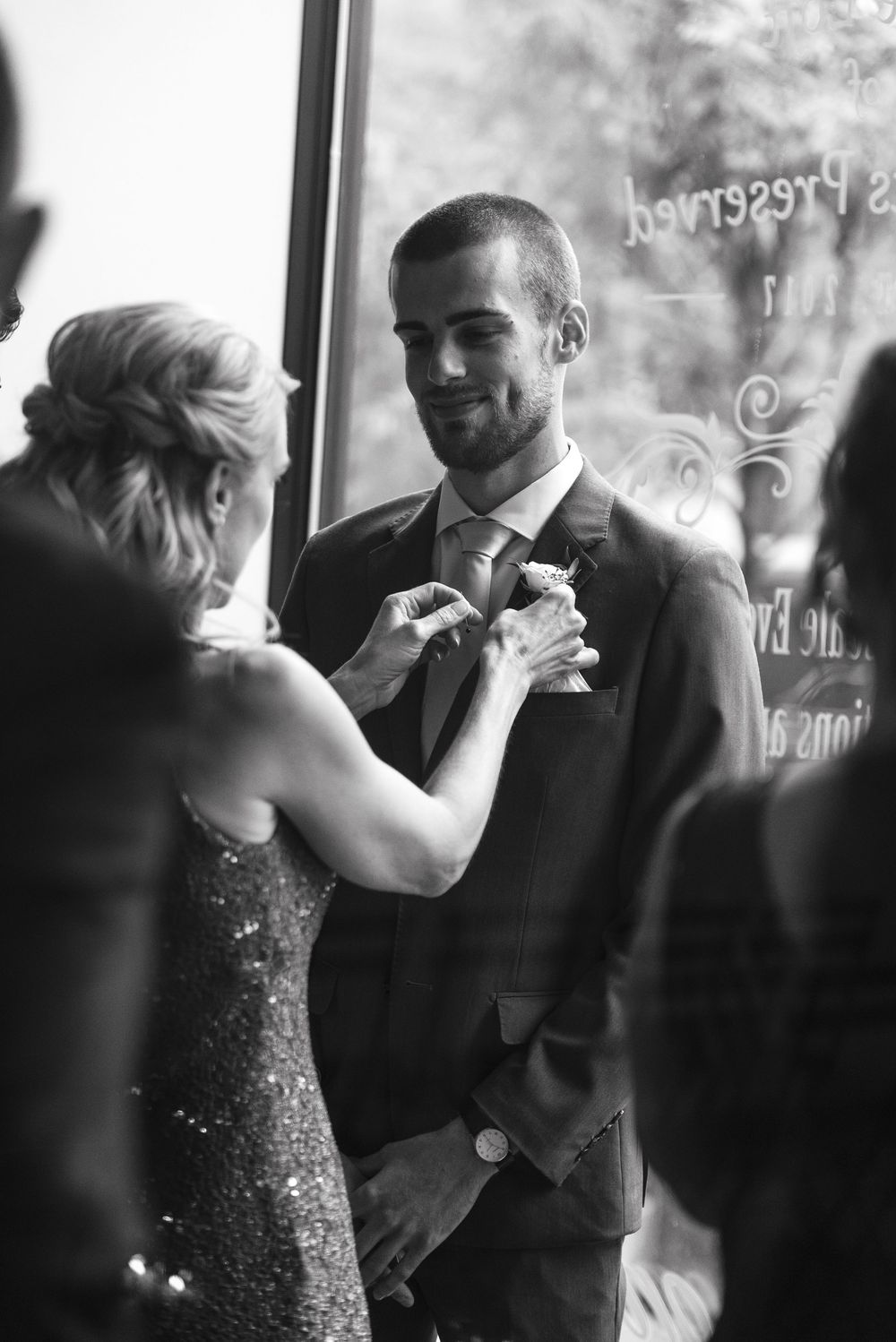 A romantic black and white sequence shows a couple sharing an intimate dance moment in a dimly lit room.