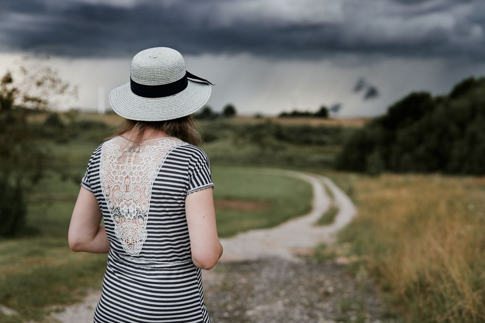 straw hat portrait, styled shoot, soft focus, countryside fashion, autumn mood, creative pose, rustic editorial, natural vibe