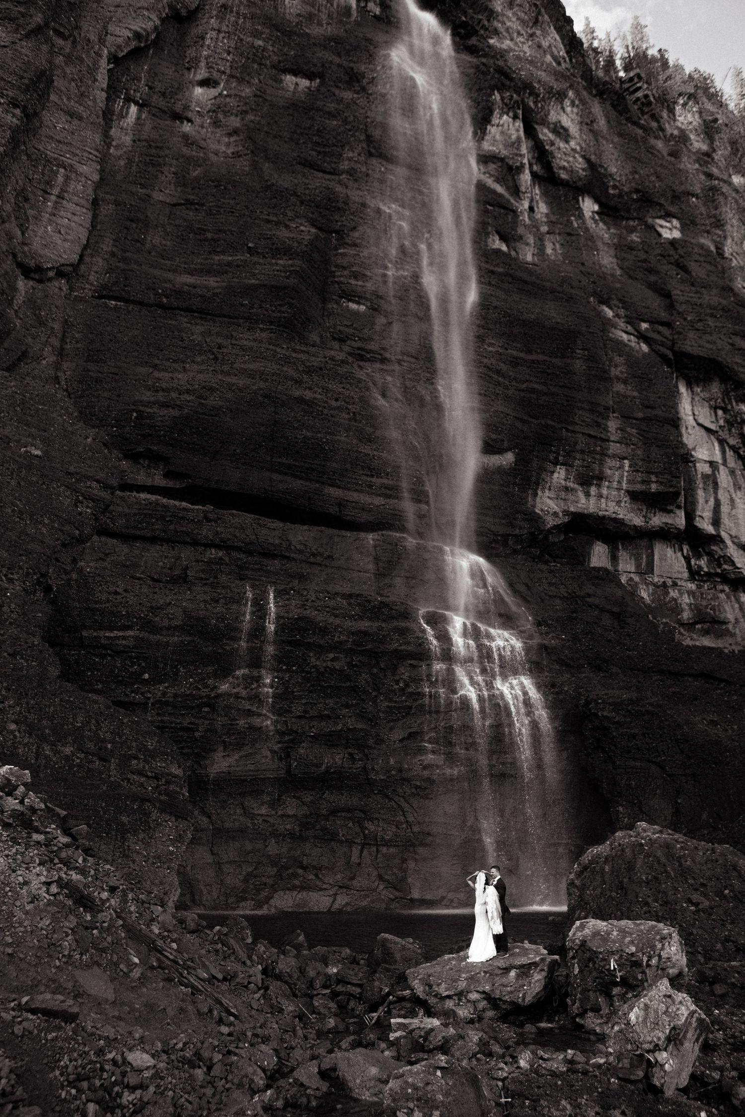 Bride and groom at the bottom of Bridal Veil Falls for their Elopement in Telluride Colorado
