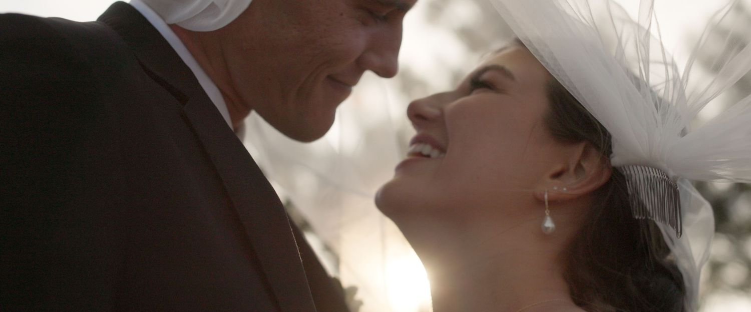 A romantic couple in wedding attire share tender moments in a series of intimate close-up shots.