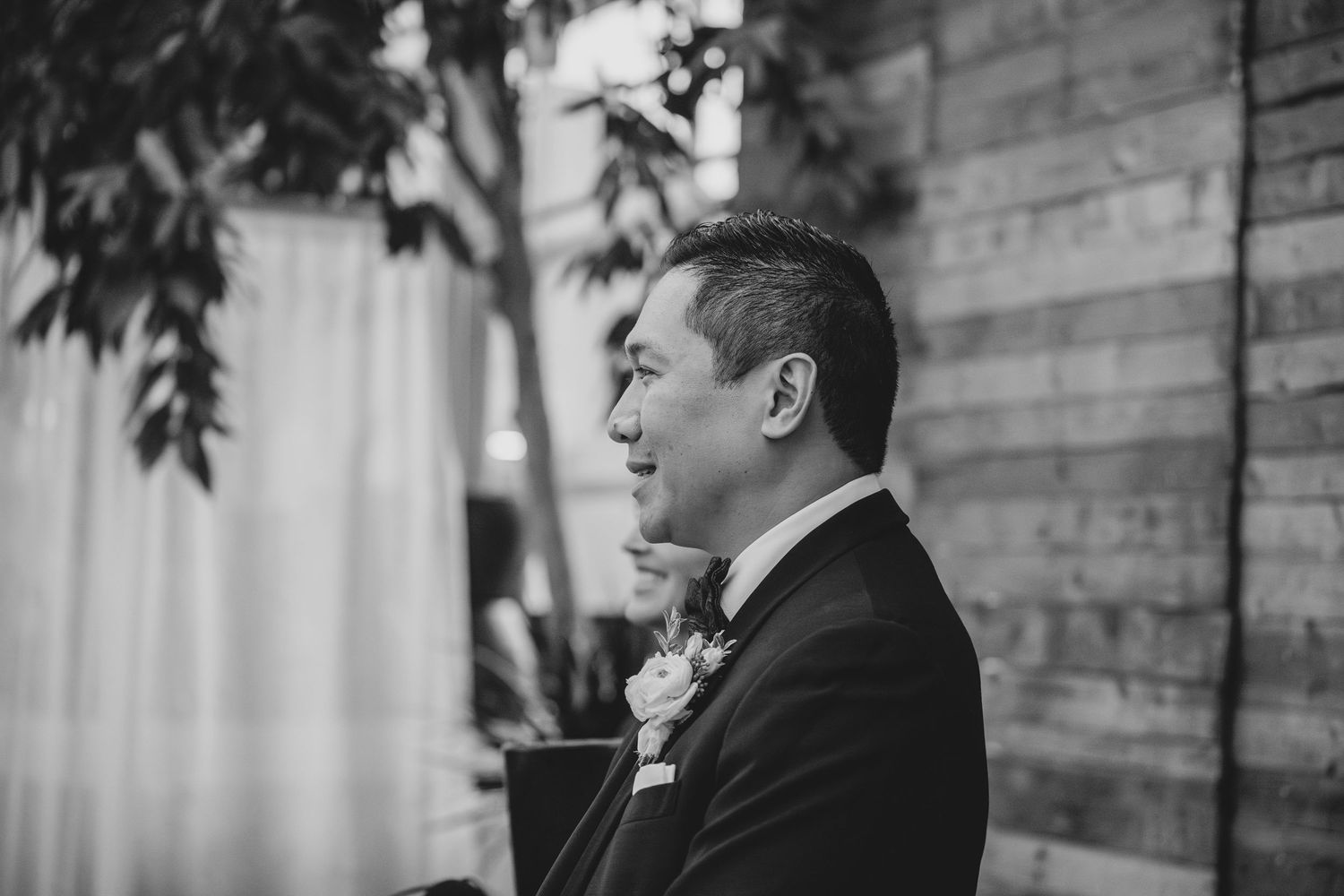 Black and white wedding photo sequence showing couple during ceremony in romantic garden setting.