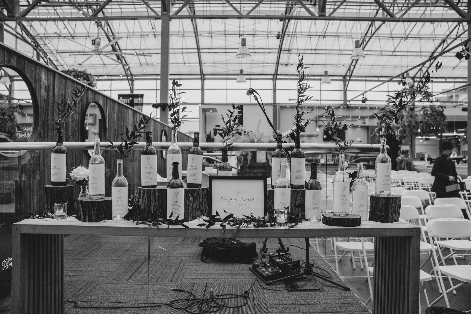 Factory workers operate assembly line machinery in a large industrial manufacturing facility.