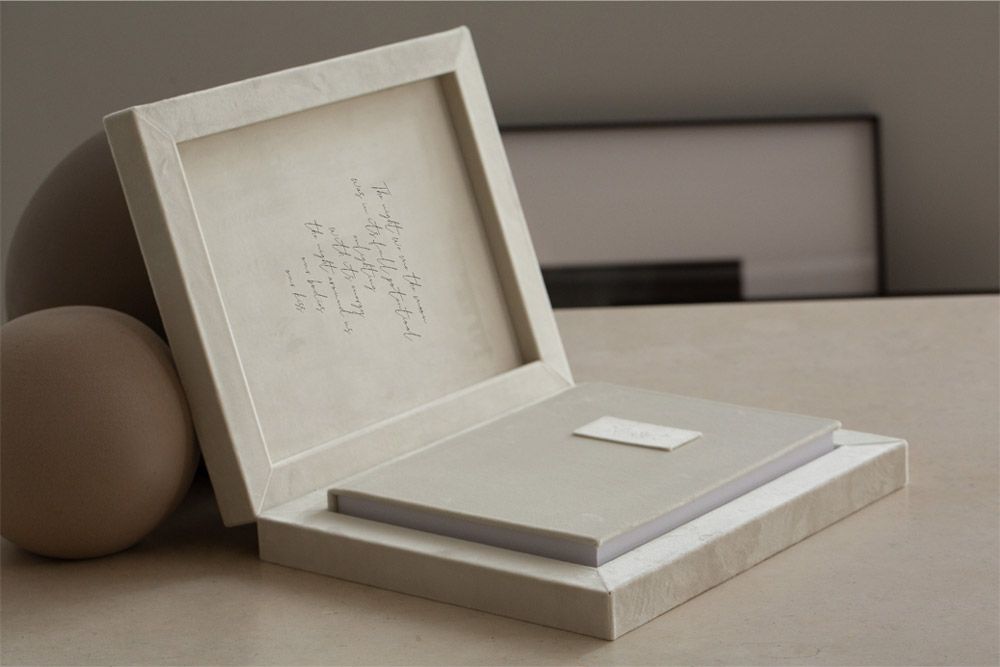 Custom-designed album with romantic maternity couple portraits.