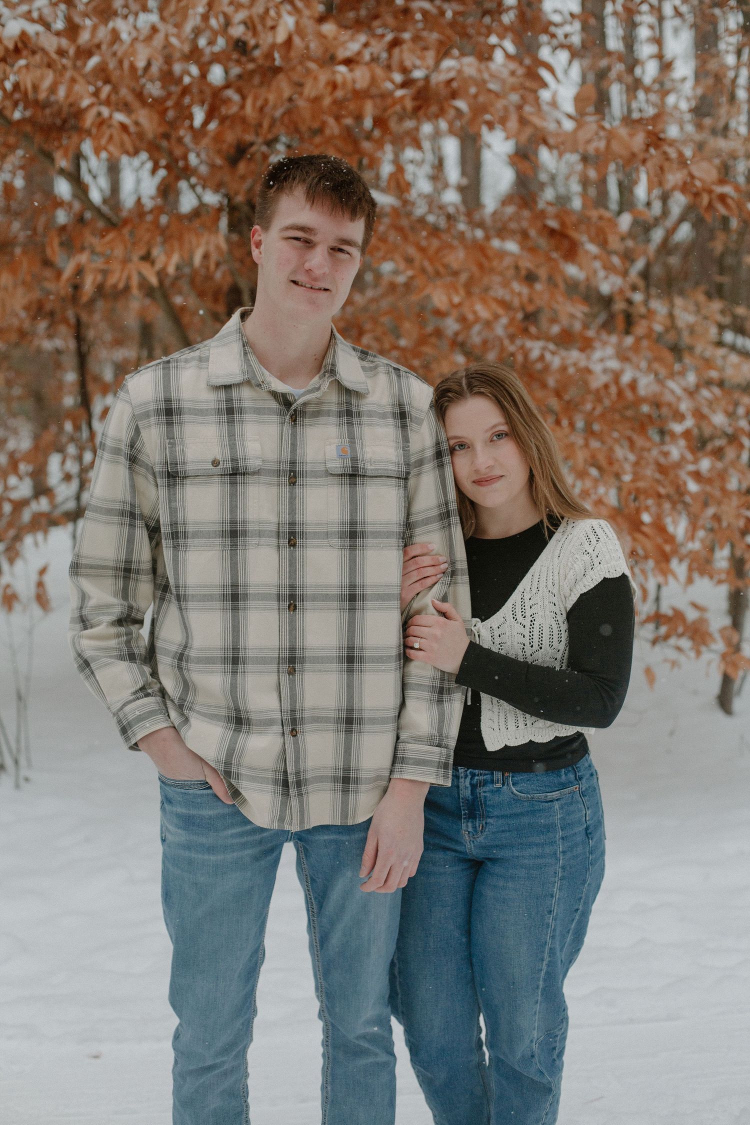 Couple during their winter engagement session in Holland, MI.