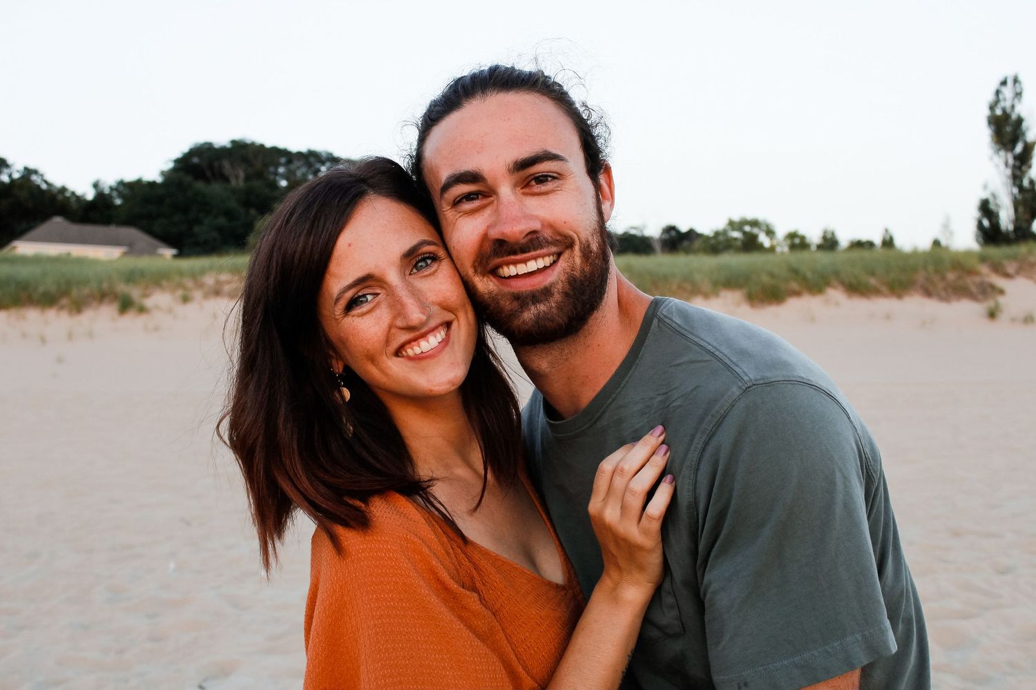 Couple on the beach in Holland, MI during their couple session.