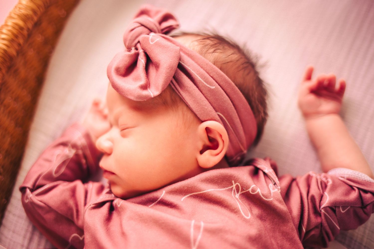 Oklahoma City newborn session with sleepy baby wrapped in cream tones