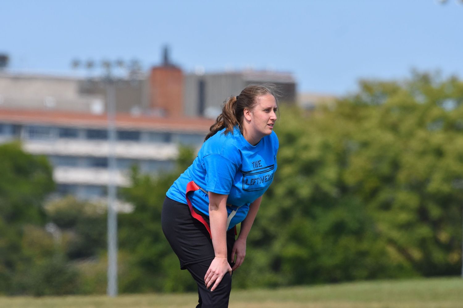 A flag football player lines up at the line of scrimmage at Cricket Hill with Chicago in the background
