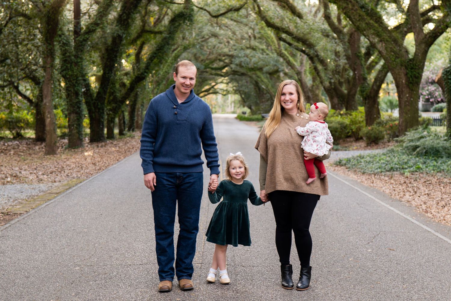 Family photo session in front of Oak Trees in Magnolia Springs, Alabama