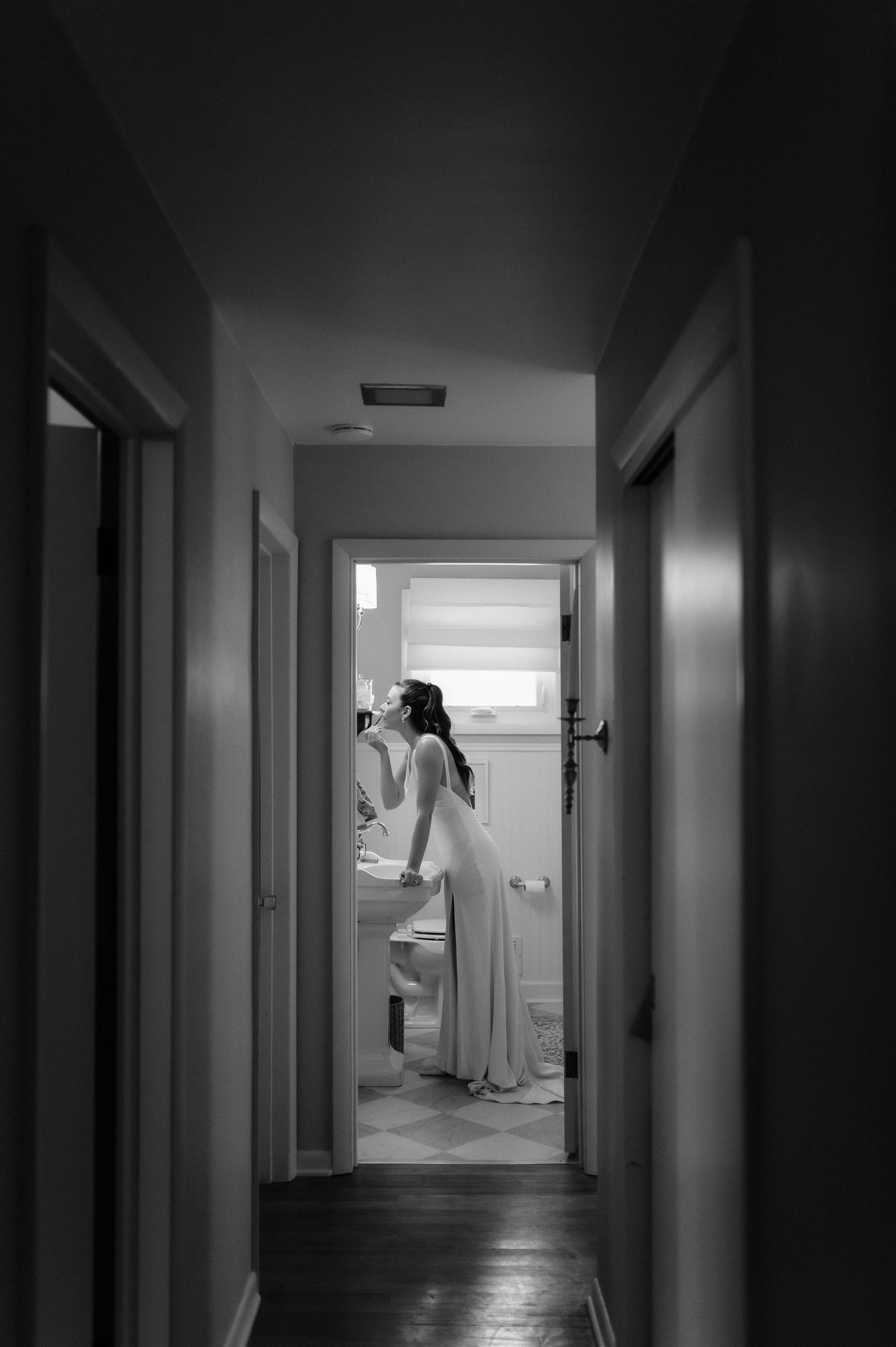 Moody black and white photographs of empty hospital corridors and doorways create an eerie atmospheric sequence.