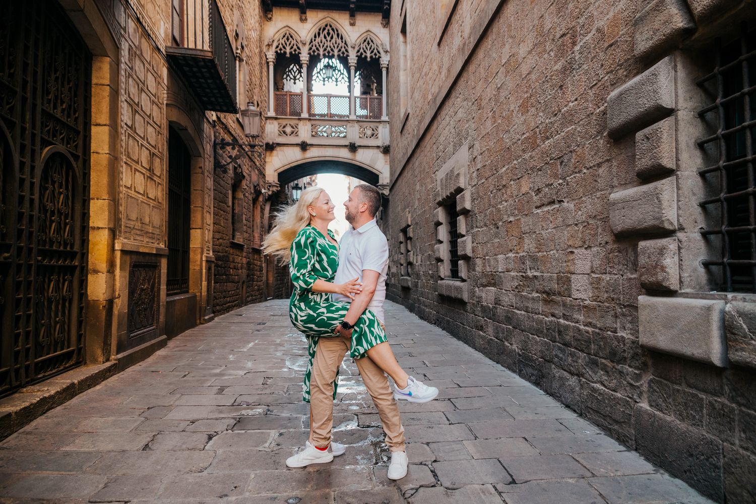 Barcelona anniversary shoot with couple by vintage wooden doors