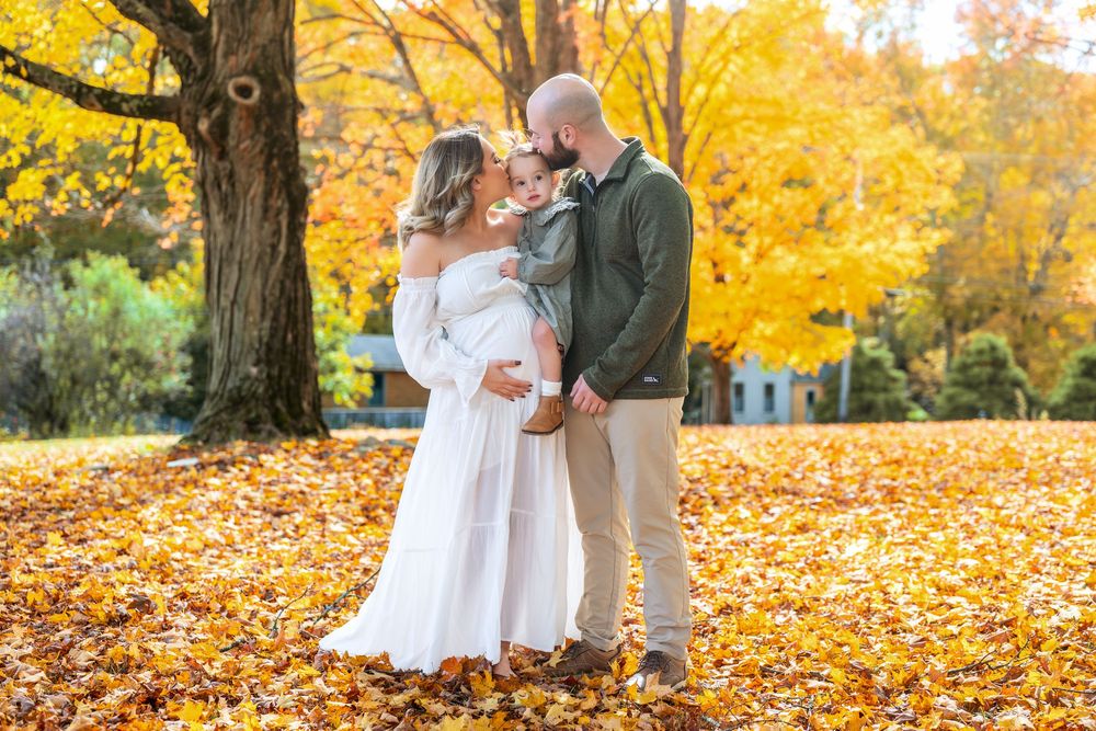 Autumn wedding photography with golden leaves and white dress in natural outdoor setting.
