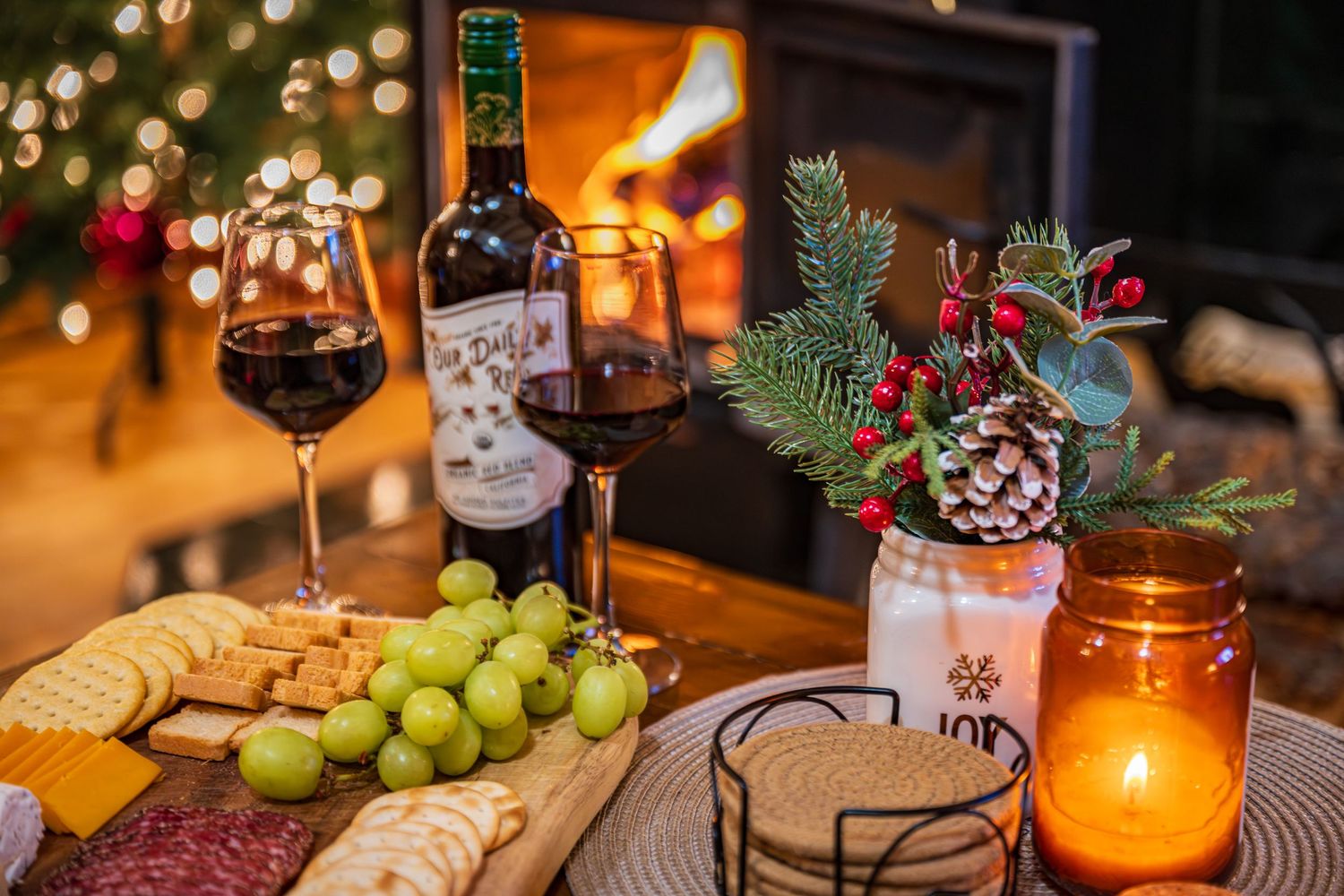 Image of wine, charcuterie board and fire place