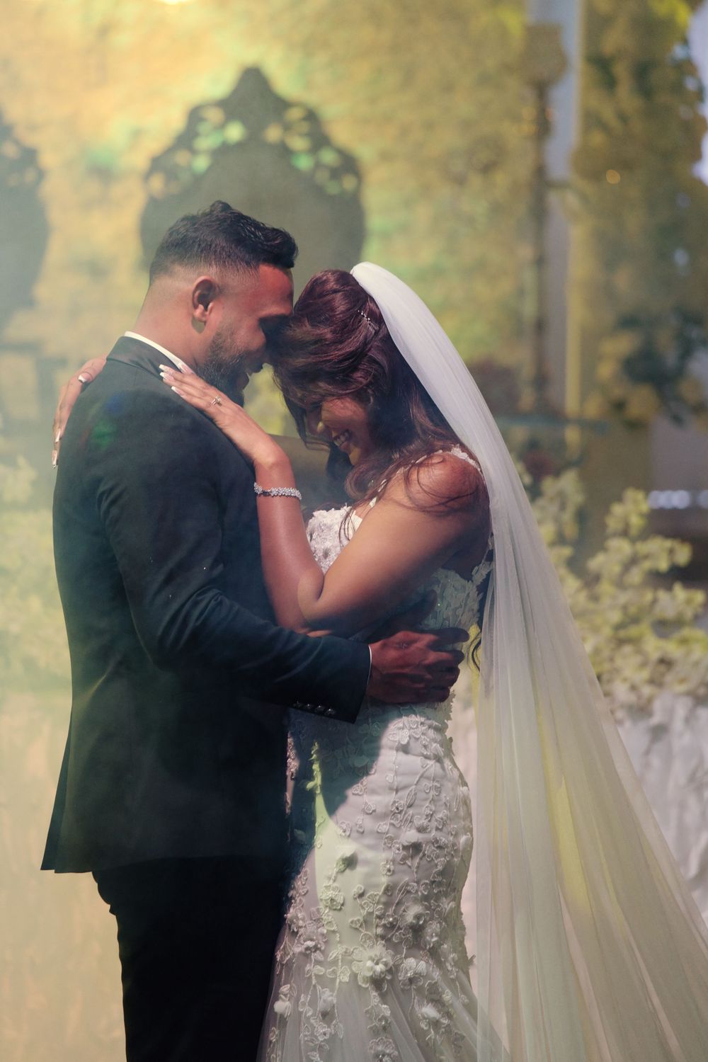 A romantic sequence of wedding photos showing a couple sharing their first kiss during an outdoor ceremony.