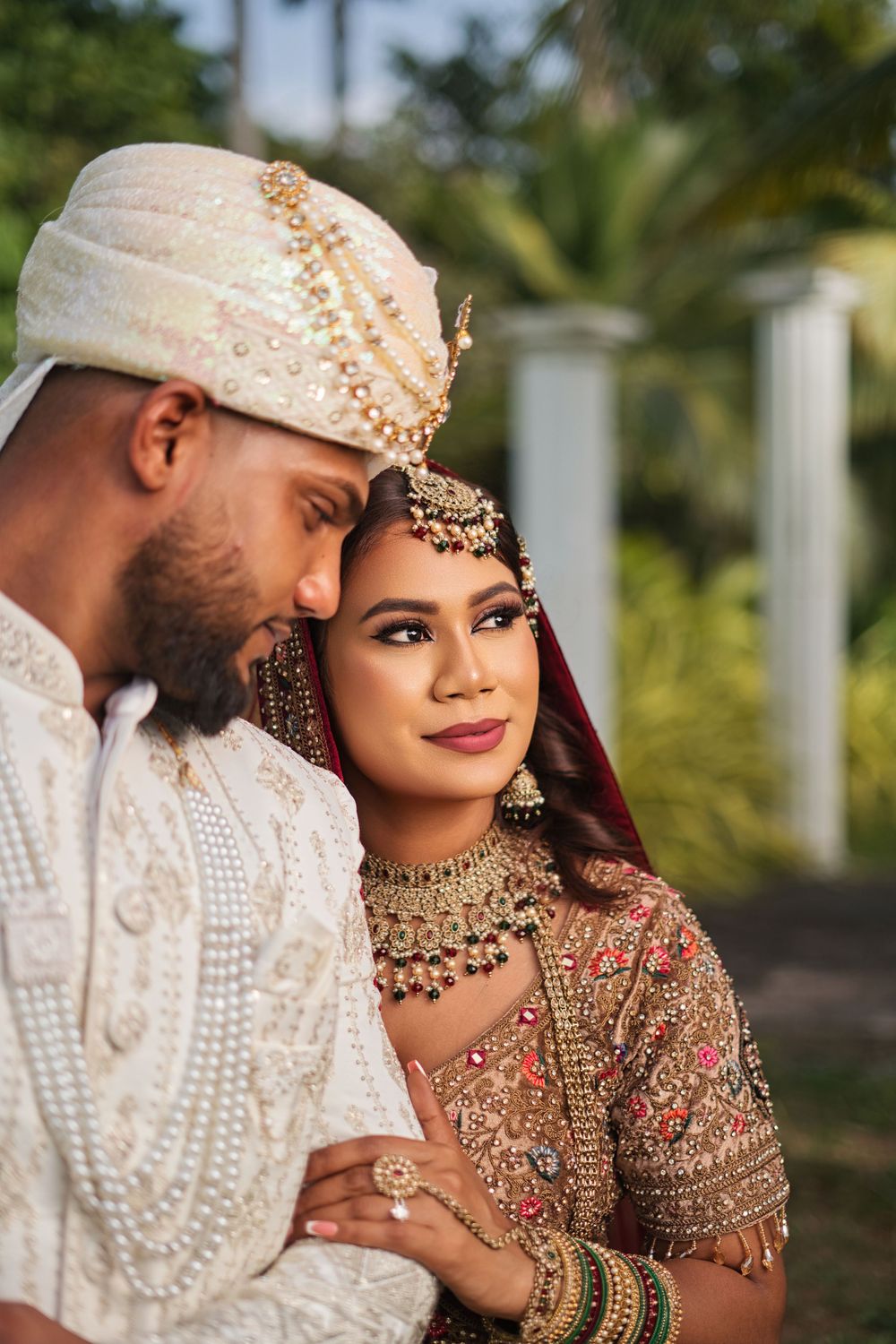 A romantic wedding photo series showing a couple in traditional South Asian bridal attire with ornate gold jewelry and details.