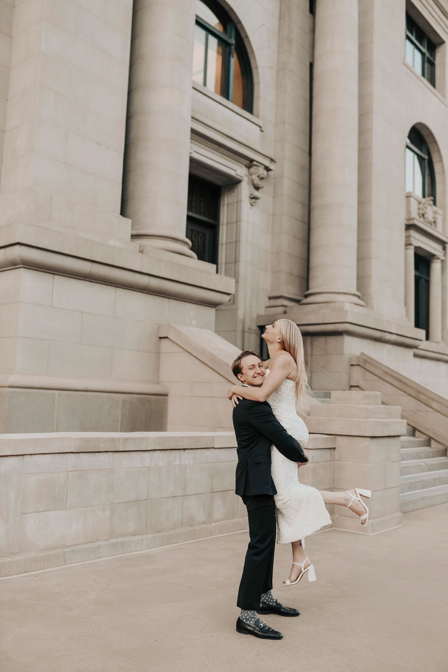 Downtown Dallas engagement photography capturing couple in a vintage urban setting
