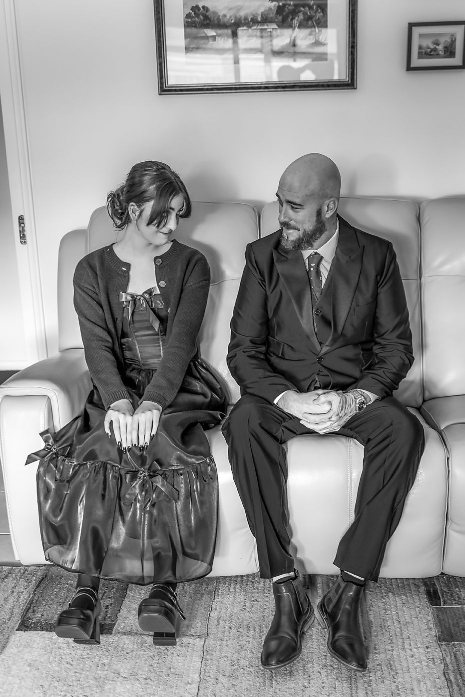 Black and white photo sequence shows a person progressively falling asleep while sitting on a couch.