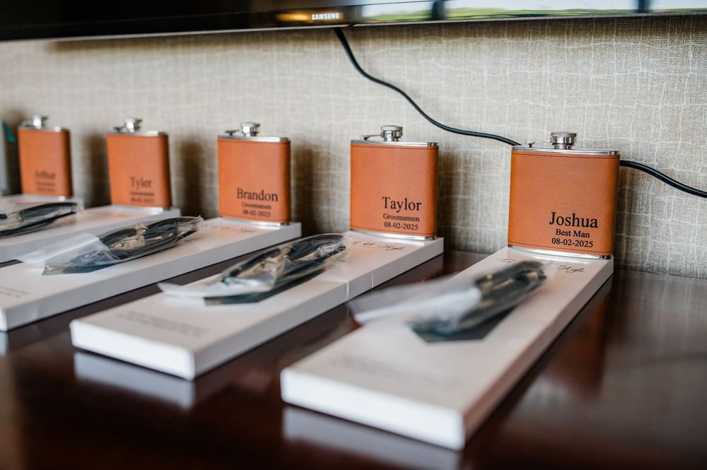 Row of matching leather-bound photo albums arranged neatly on a shelf.