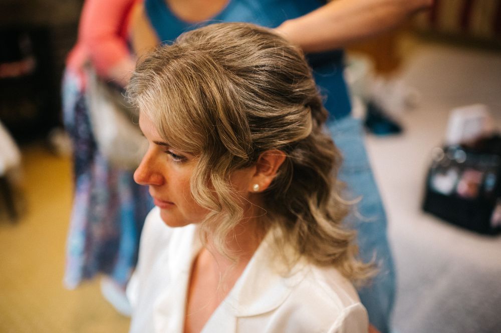 Close-up shot of bridal hair styling with soft natural lighting.