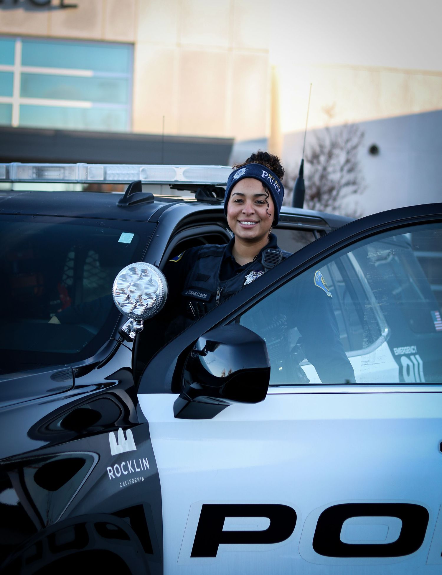 Police vehicles lined up with officers visible through open car windows.