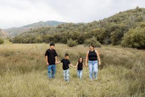 Utah family photography session in open field, children walking together outdoors