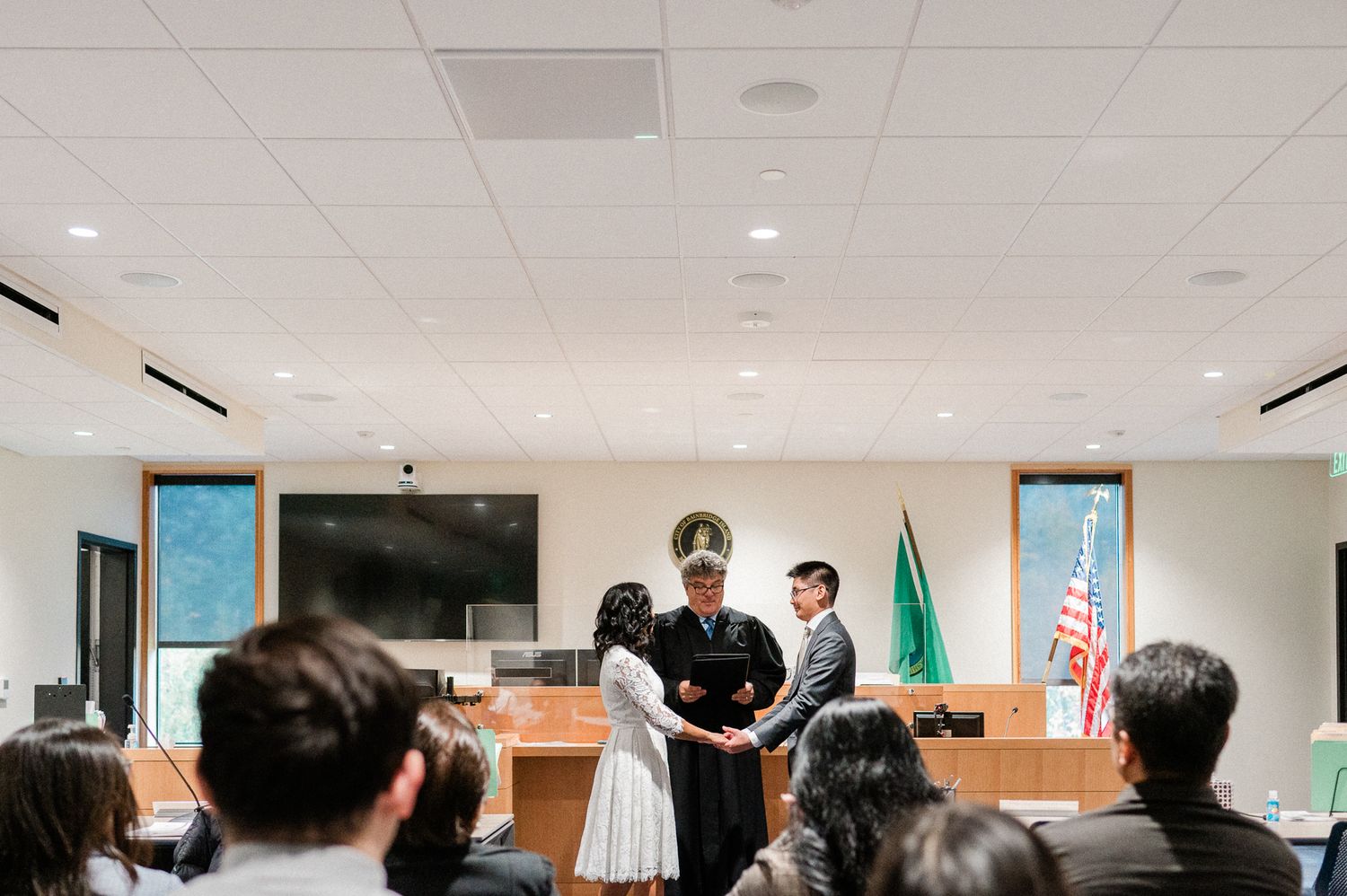 couple getting married at courthouse with all the friends and family