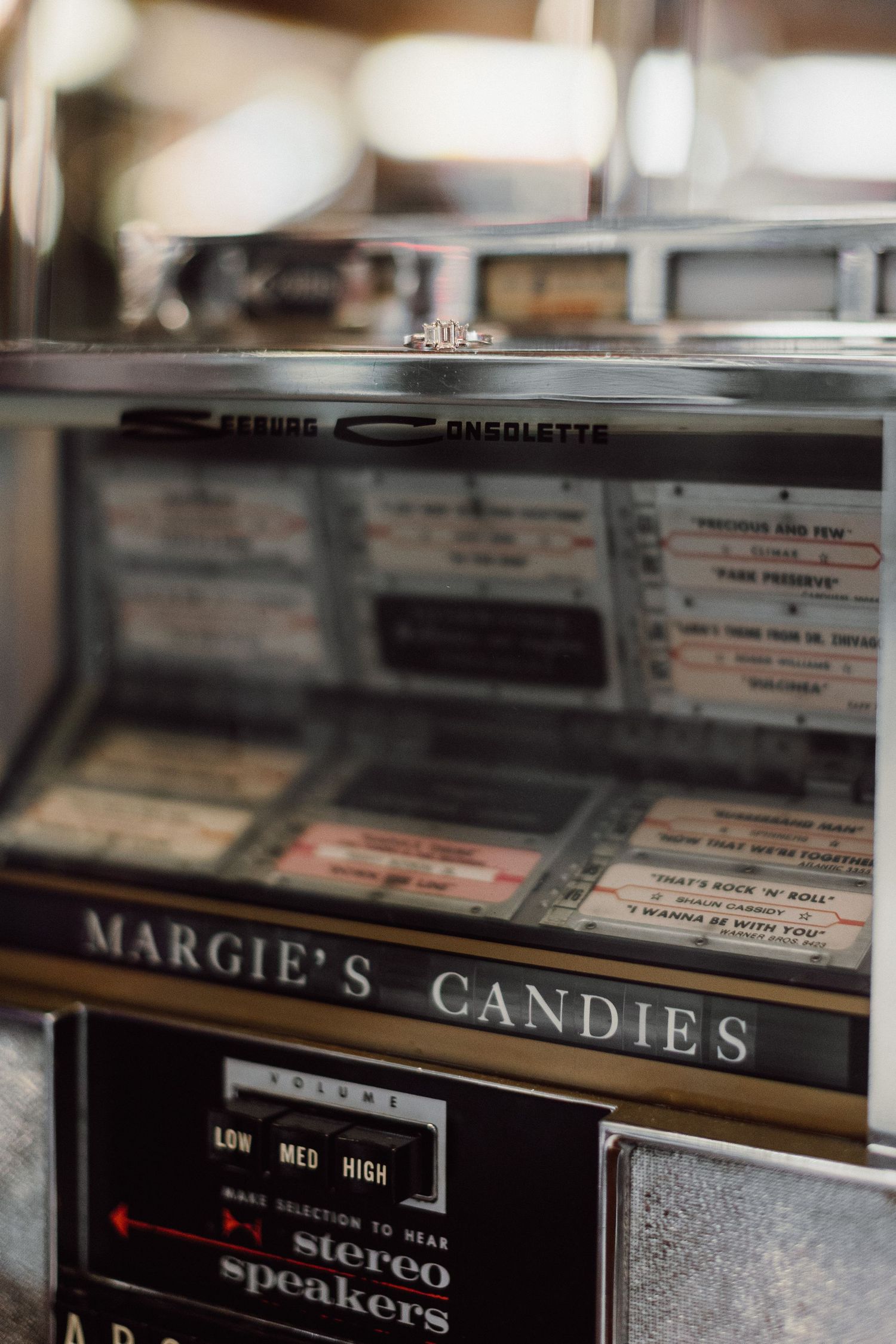 Close-up of vintage candy shop display cases with Margie's Candies branding.