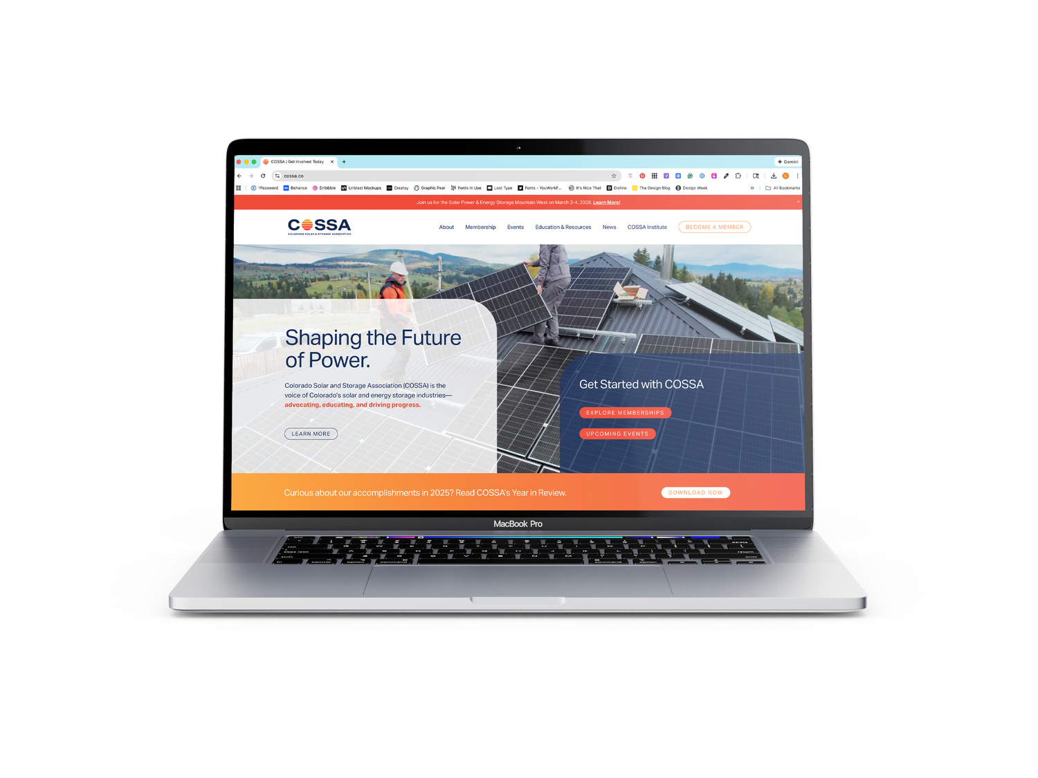 Modern website design for solar company displayed on silver laptop screen.