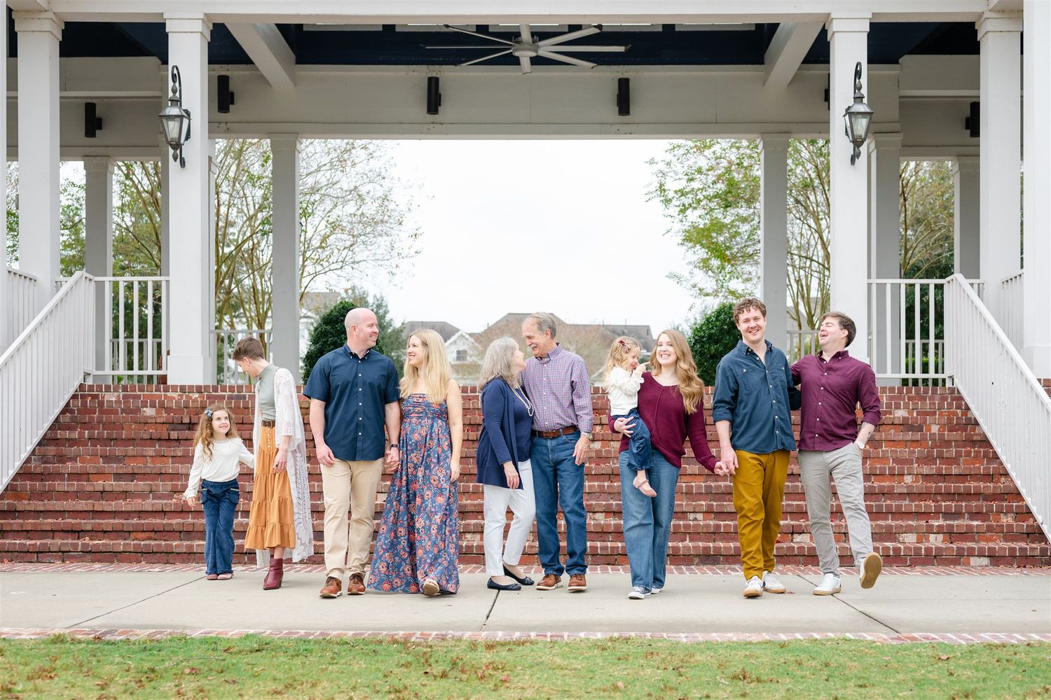 A family stands together on a white gazebo porch in Conroe, Texas.