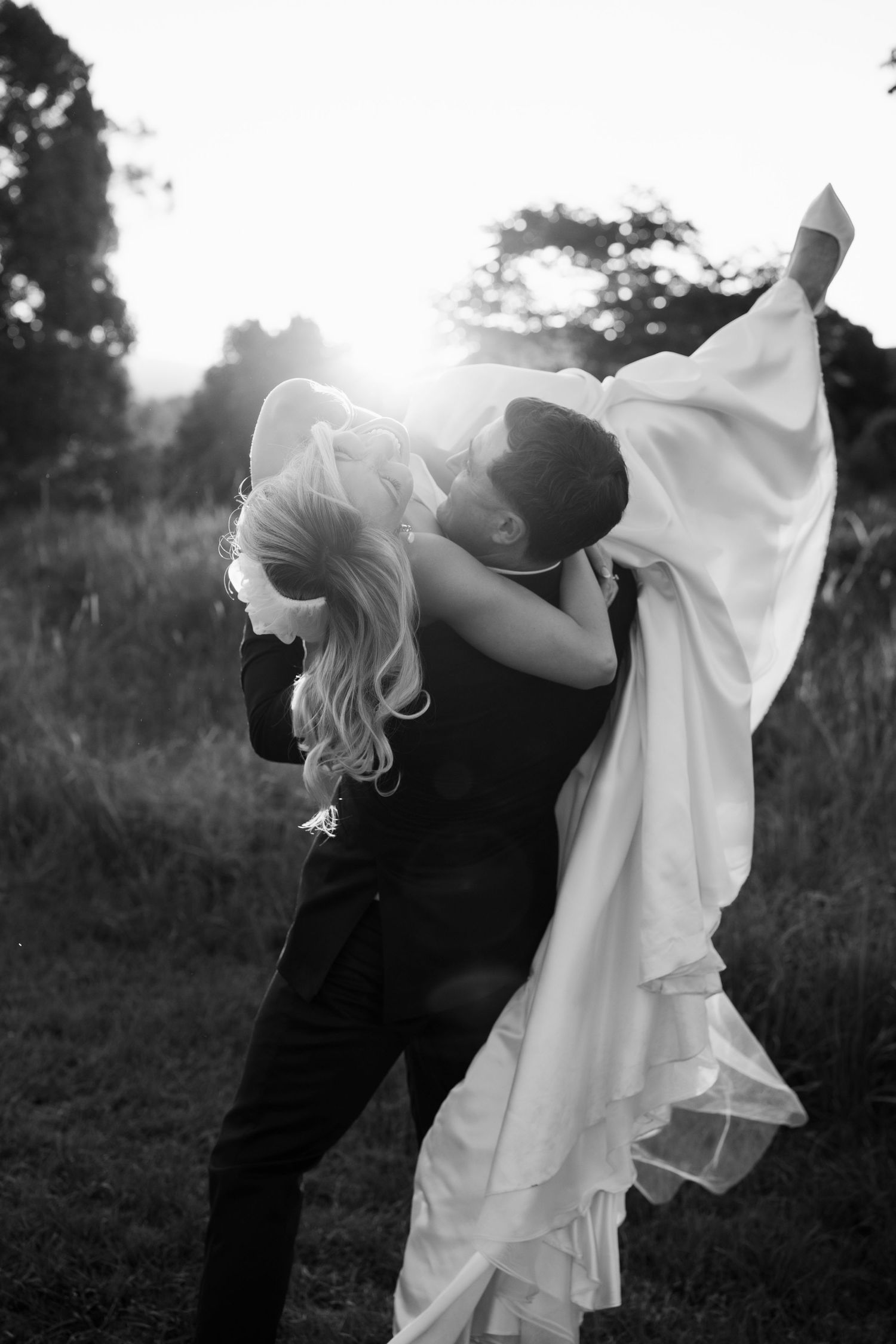 A romantic wedding couple shares intimate moments in a series of black and white photographs on a terrace.