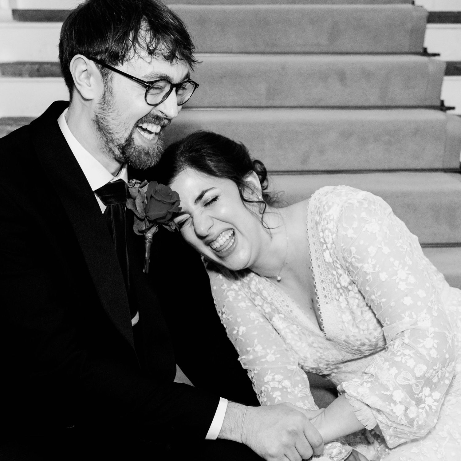 A series of black and white wedding photos showing tender moments between a couple in formal attire.
