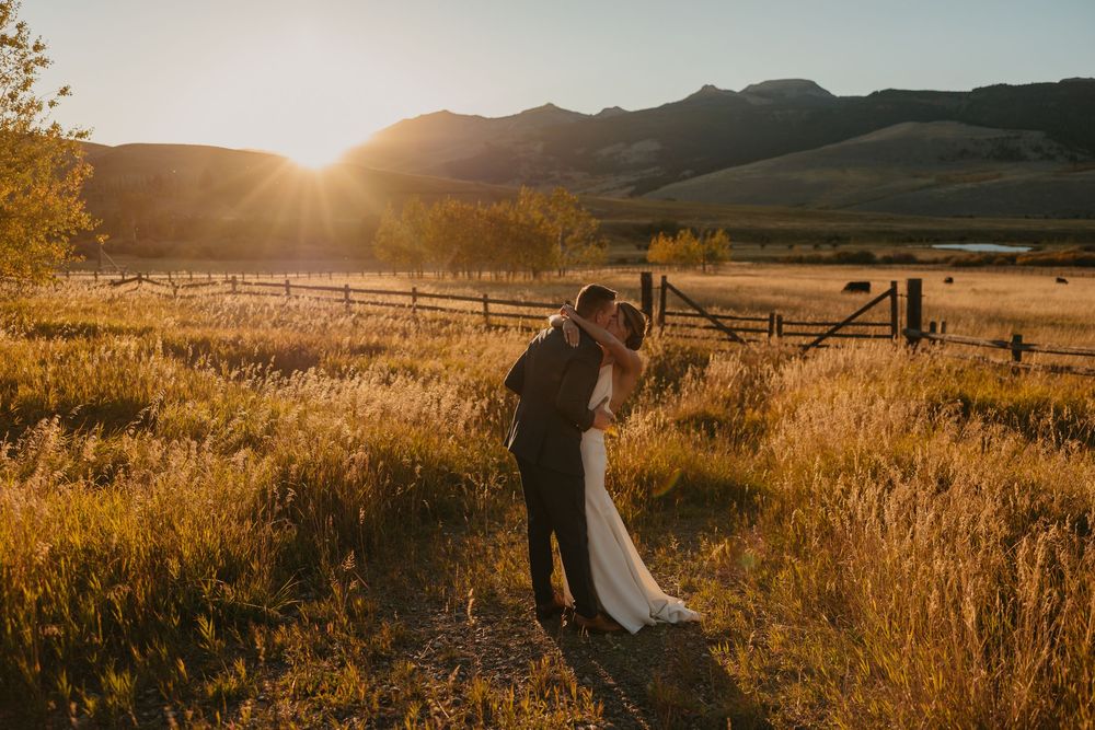 Couple embraces in Mountains of Grizzly Creek Ranch Wedding in Emigrant Montana at sunset captured by Pray Montana Wedding Photographer