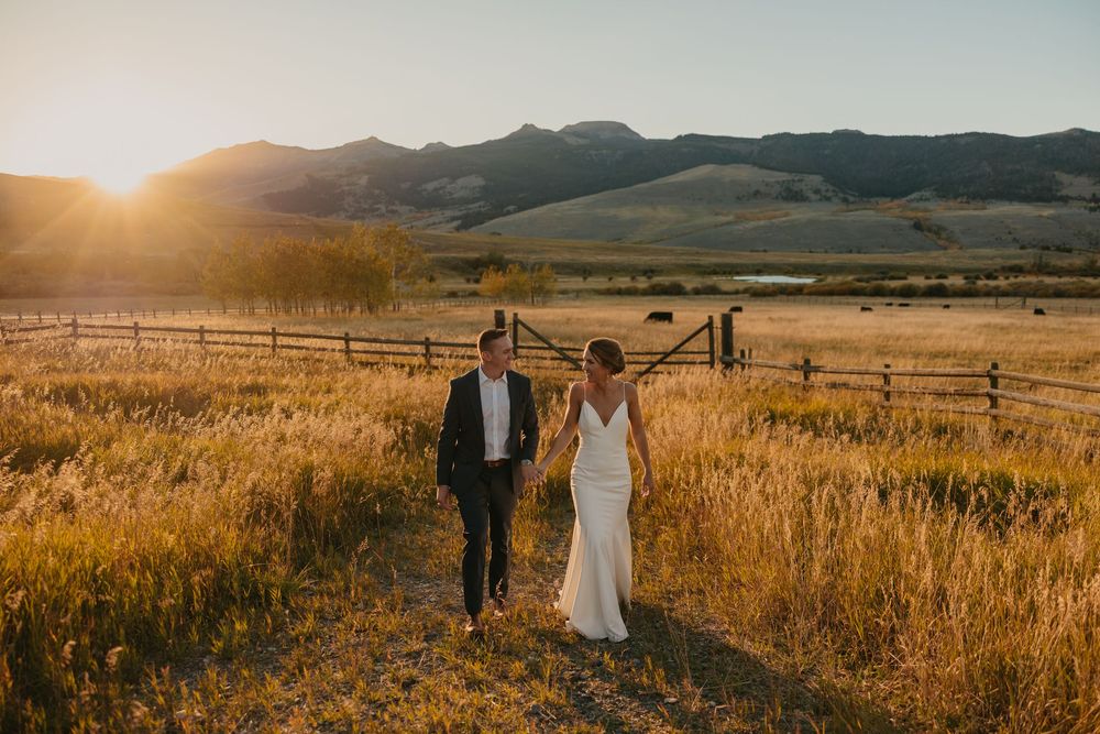 Couple embraces in Mountains of Grizzly Creek Ranch Wedding in Emigrant Montana at sunset captured by Pray Montana Wedding Photographer