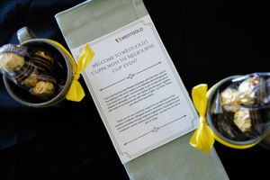 Westgold welcome letter with chocolate treats and yellow ribbons at Melbourne Cup event.