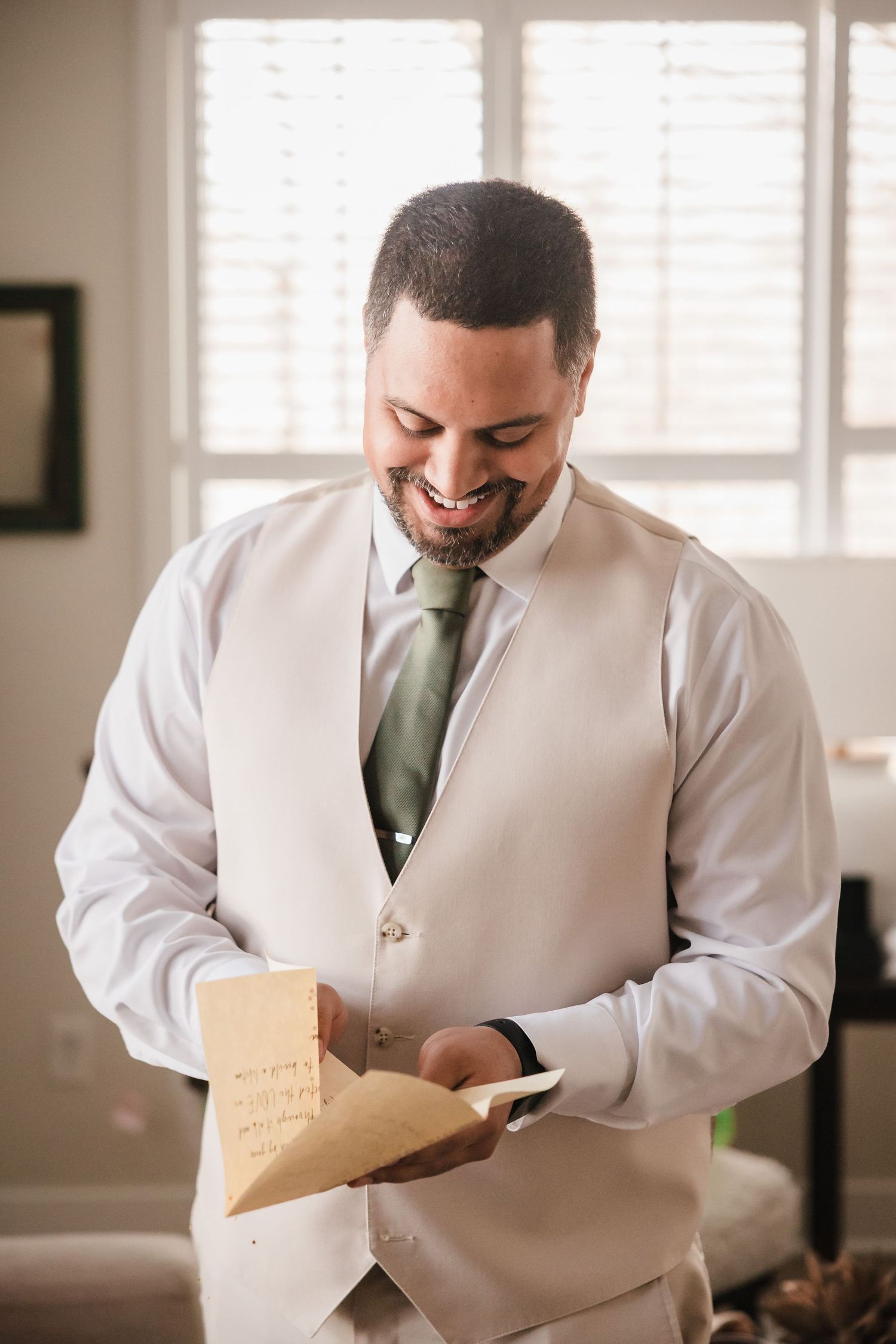 Groom reading heartfelt letter during getting ready at Briar Barn Inn wedding Massachusetts