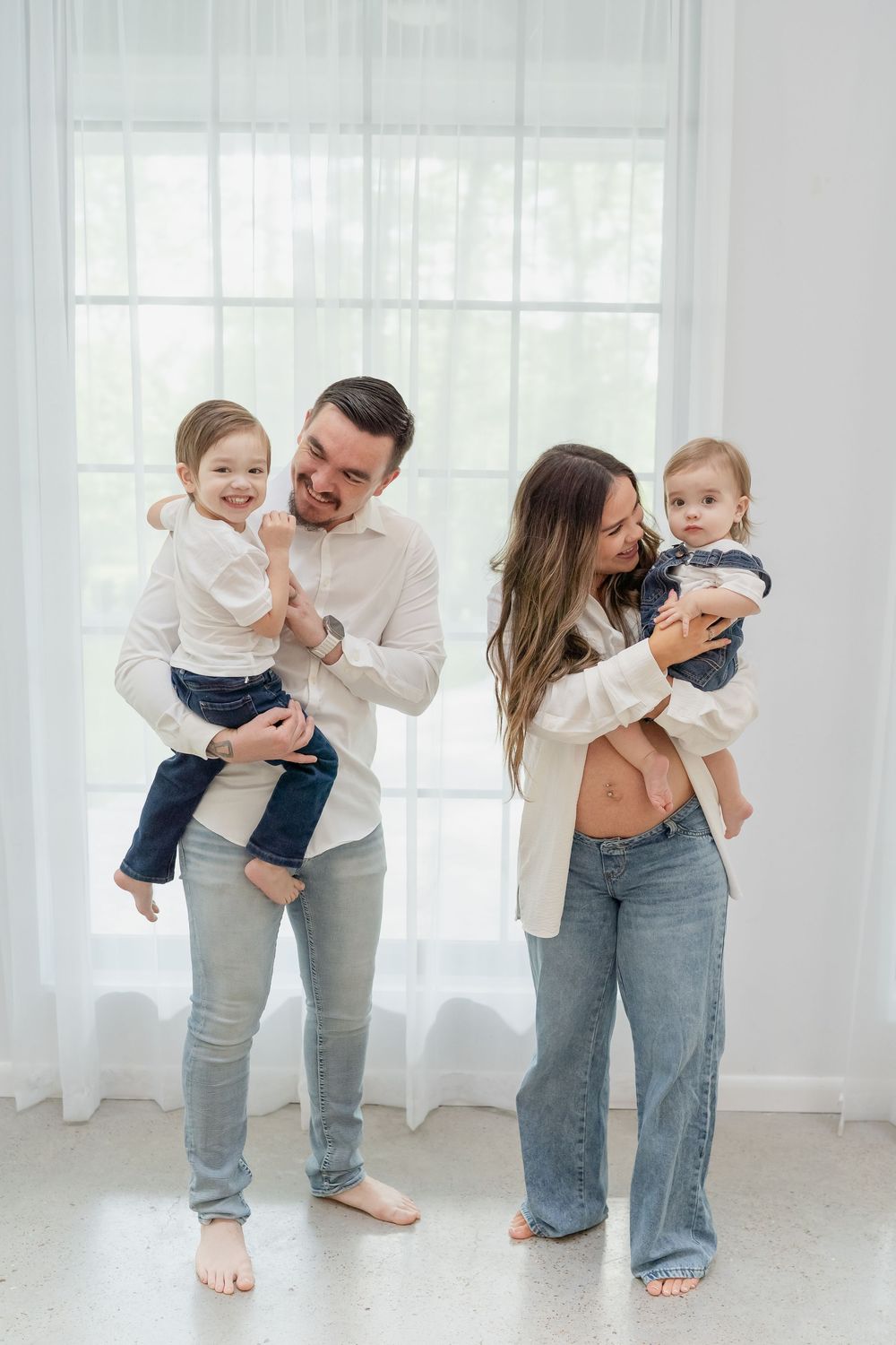Maternity Family Photo Session by Conroe Photographer and Houston Photographer, Studio, white top and blue jeans