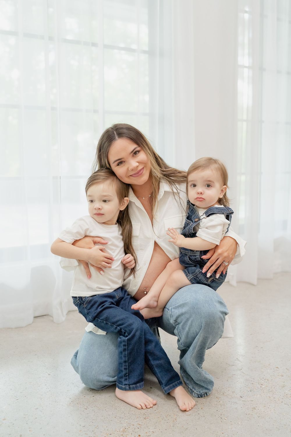Maternity Family Photo Session by Conroe Photographer and Houston Photographer, Studio, white top and blue jeans